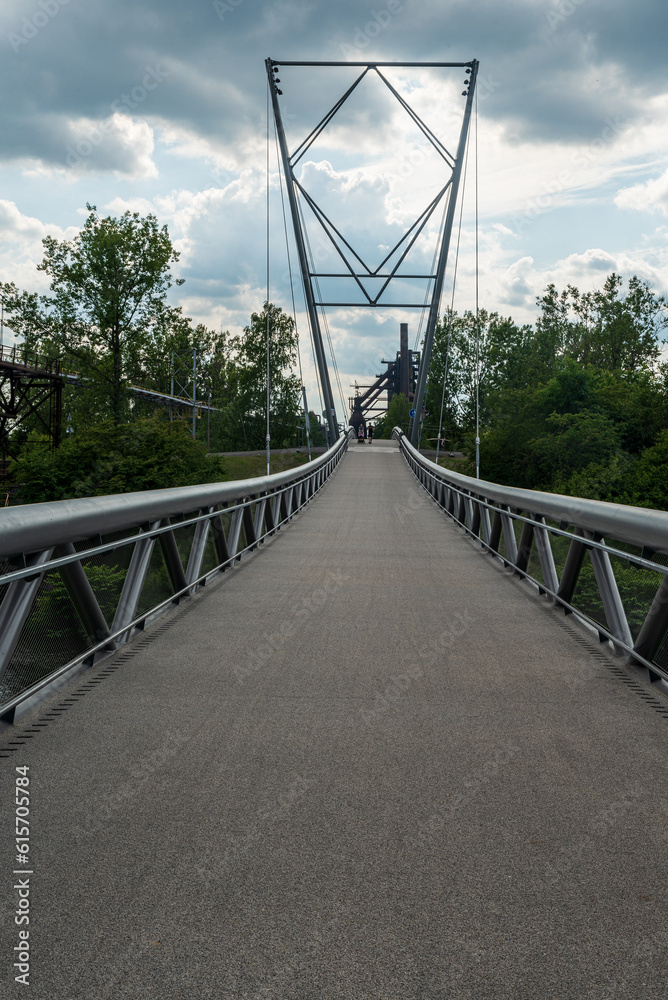 Obraz premium New bridge connesting bike path near Ostravice river and Dolni oblast Vitkovic in Ostrava city in Czech republic