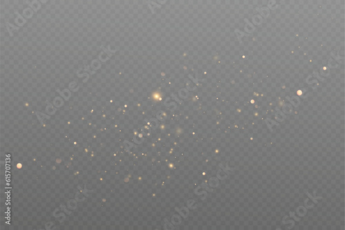 Golden sequins glow with many lights. Glittering dust. Luxurious background of golden particles.
