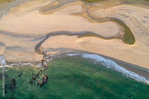 zenithal aerial drone view of the shore of a beach