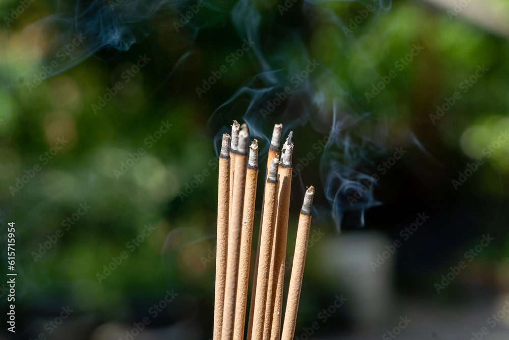 Burning Incense sticks with copy space for text or advertising Burning Incense sticks with copy space for text or advertising