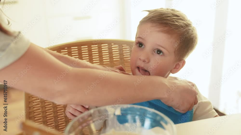 the child does not want to eat porridge. happy family healthy food concept. the boy little son eats fun porridge with a spoon soiled in his face. child dirty eating porridge himself video the child does not want to eat porridge. happy family healthy food concept. the boy little son eats fun porridge with a spoon soiled in his face. child dirty eating porridge himself video