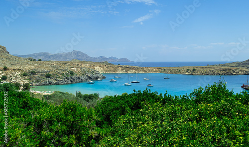 Fototapeta Naklejka Na Ścianę i Meble -  Panoramic view of the beautiful secluded bay and beach at Lindos town on the island of Rhodes, Greece