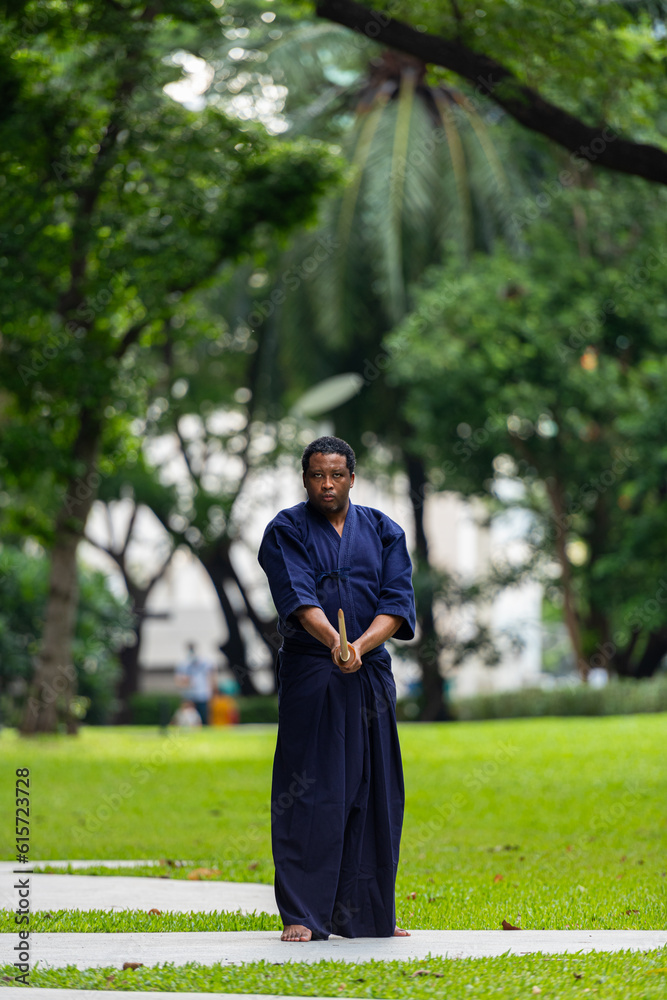 Handsome black martial artist man with martial arts costume of kendo Handsome black martial artist man with martial arts costume of kendo