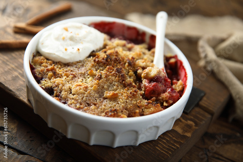 Картината върху платно Traditional homemade berry crumble with cream