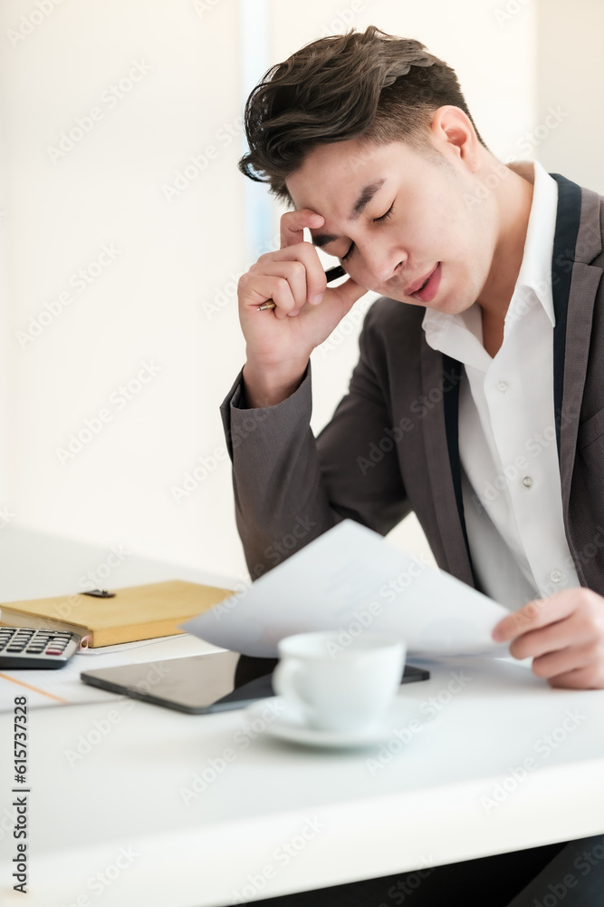 Stressed business man working in the office. Stressed business man working in the office.
