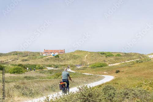 Cycling road through the dunes from Formerum to the beach at Wadden island Terschelling in Friesland province in The Netherlands photo