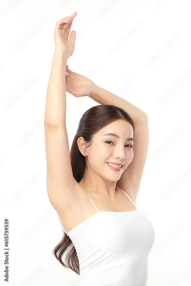 Beautiful Young Asian woman lifting hands up to show off clean and hygienic armpits or underarms on white background, Smooth armpit cleanliness and protection concept Beautiful Young Asian woman lifting hands up to show off clean and hygienic armpits or underarms on white background, Smooth armpit cleanliness and protection concept