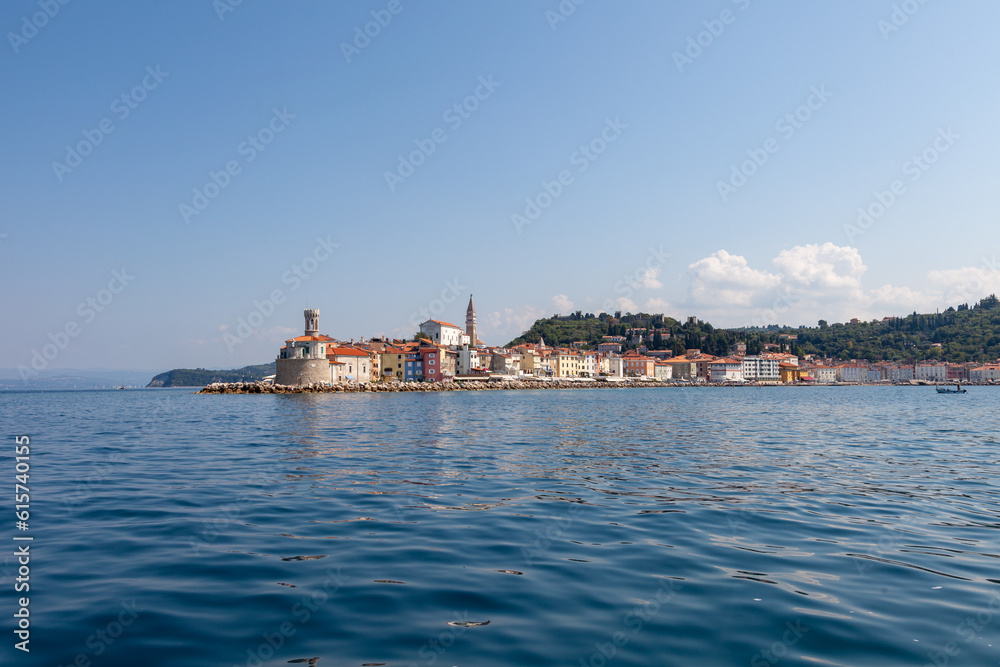 Sunny Piran city on Slovenian adriatic coast, Europe. View from the sea. Image taken from a boat.
