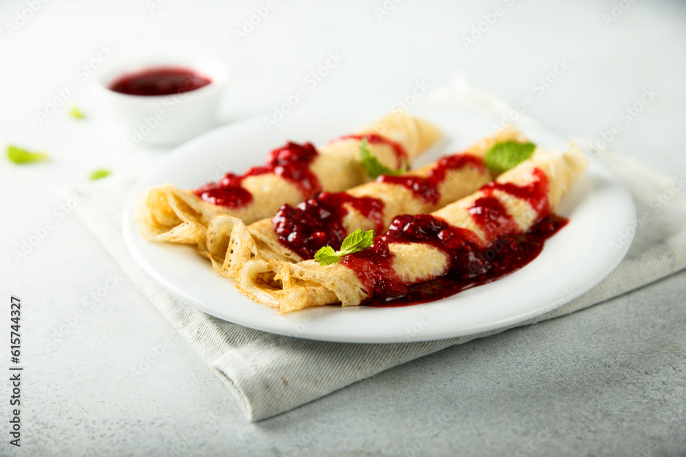 Homemade crepes with raspberry sauce