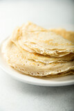 Traditional homemade crepes on a white plate
