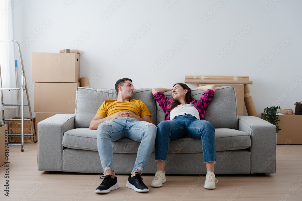 Young couple relaxing in their new home