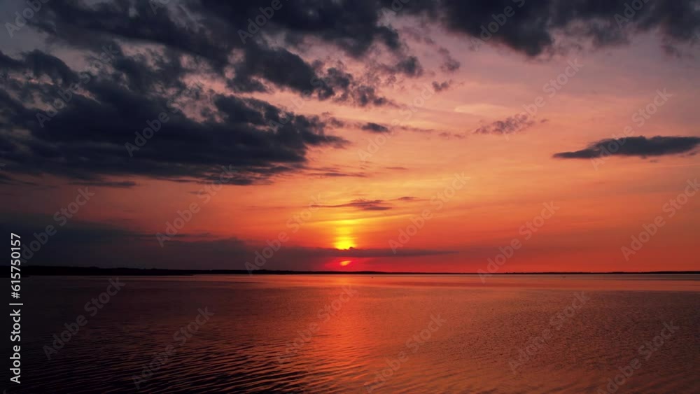 Red sunset by the lake. Hot weather at sunset. Dramatic red sunset at desert. Heatwave hot sun. Climate Change. Global Warming. Red sunset by the lake. Hot weather at sunset. Dramatic red sunset at desert. Heatwave hot sun. Climate Change. Global Warming.
