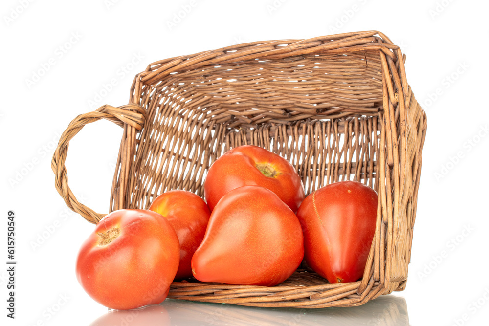 Several juicy red tomatoes in a basket, macro, isolated on a white background. Several juicy red tomatoes in a basket, macro, isolated on a white background.