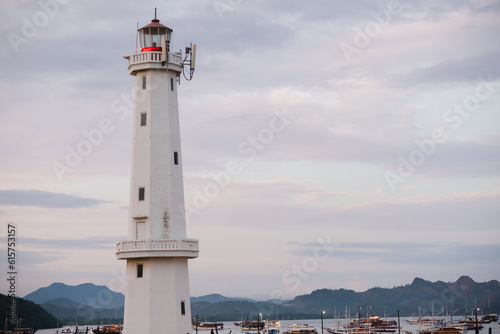 A beautiful white lighthouse against the sky in the port town of Labuan Bajo  Indonesia.