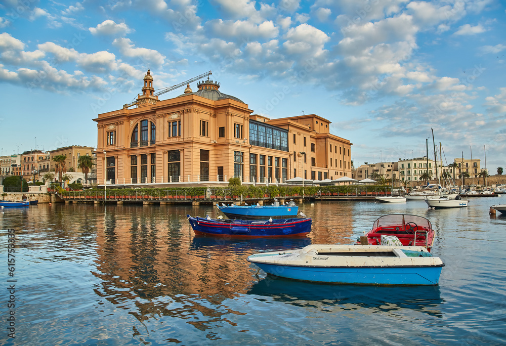 Margherita Theater and fishing boats in old harbor of Bari, Italy. Bari is the capital city of the Metropolitan City of Bari on the Adriatic Sea, Italy. Architecture and landmark of Italy
