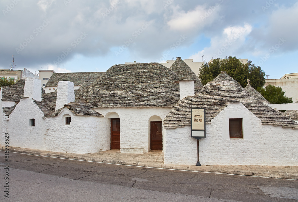 Alberobello, Puglia, Italy: Typical houses built with dry stone walls and conical roofs of the Trulli, in a beautiful day