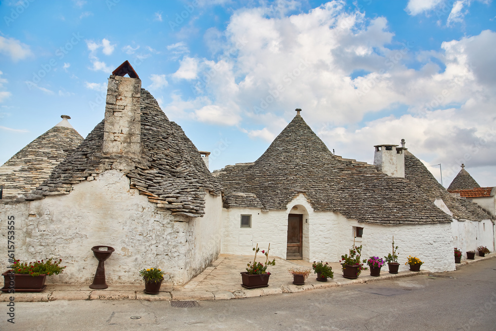 Alberobello, Puglia, Italy: Typical houses built with dry stone walls and conical roofs of the Trulli, in a beautiful day