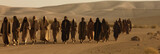 apostles are going to preach in the Judean desert. Men walk across a sandy landscape