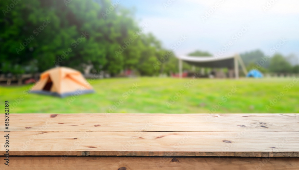 Wooden table top on blur tent camping travel tent and grass field. Fresh and Relax concept. For montage product display or design key visual layout. View of copy space. Wooden table top on blur tent camping travel tent and grass field. Fresh and Relax concept. For montage product display or design key visual layout. View of copy space.