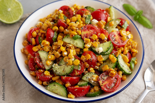 Summer Homemade Corn Salad with Cucumber and Feta, side view.