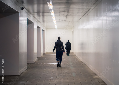 Two People Walking On The Corridor