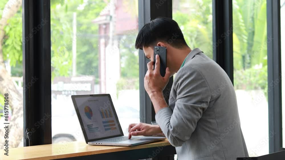 Man talking on the phone, he is a businessman investor and owner of a start-up company, he talks on the phone to employees to direct work efficiently and grow the company. Management concept. Man talking on the phone, he is a businessman investor and owner of a start-up company, he talks on the phone to employees to direct work efficiently and grow the company. Management concept.