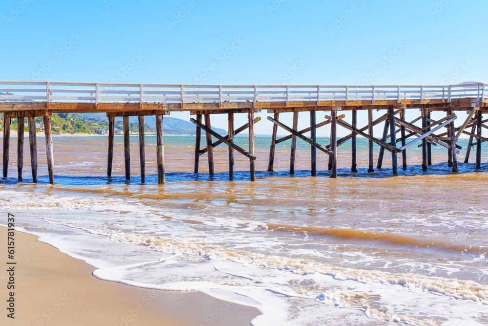 Malibu Beach: Pier Section with Hazy Waters and Blue Sky