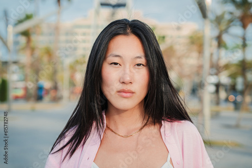 Obraz na plátně Close up individual portrait of happy asian young adult woman smiling with perfect white teeth