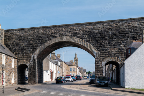 18 June 2023. Cullen,Moray,Scotland. This is a view of Cullen main street via the old disused Railway Viaduct on a sunny summer day.