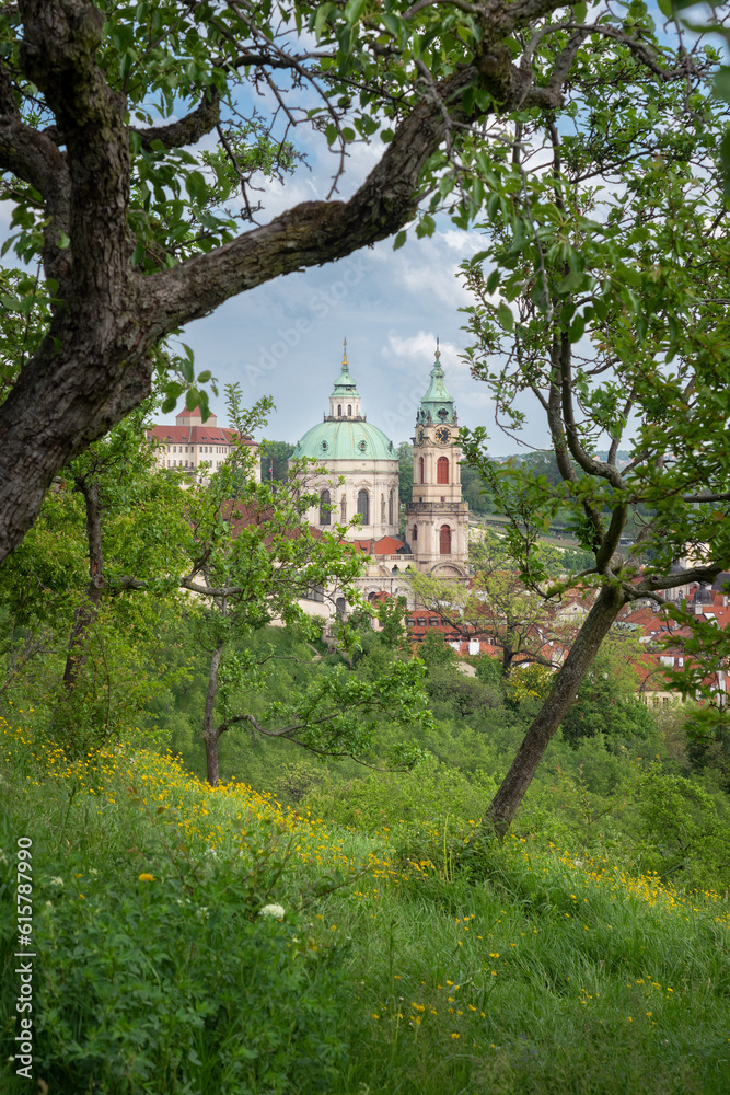 spring view of the church of St. Nicholas from the Seminary Garden under Petřín hill, Prague, the capital of the Czech Republic