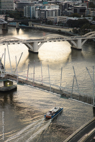 A CityCat passes underneath the Kurilpa Bridge heading towards William Jolly Bridge photo