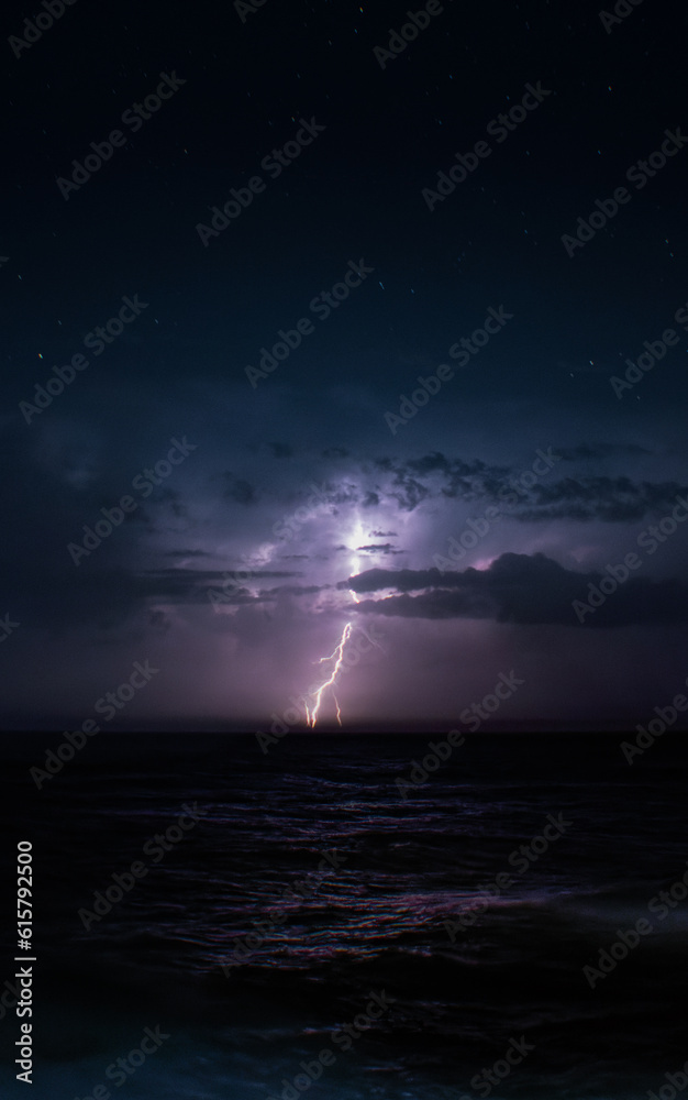 Lightning Storm out at Sea at Nighttime Lightning Storm out at Sea at Nighttime