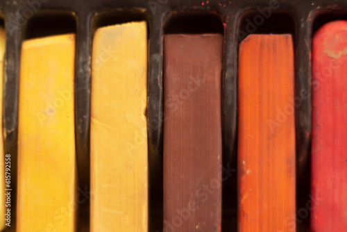 close-up of pastel crayons in a box top view
