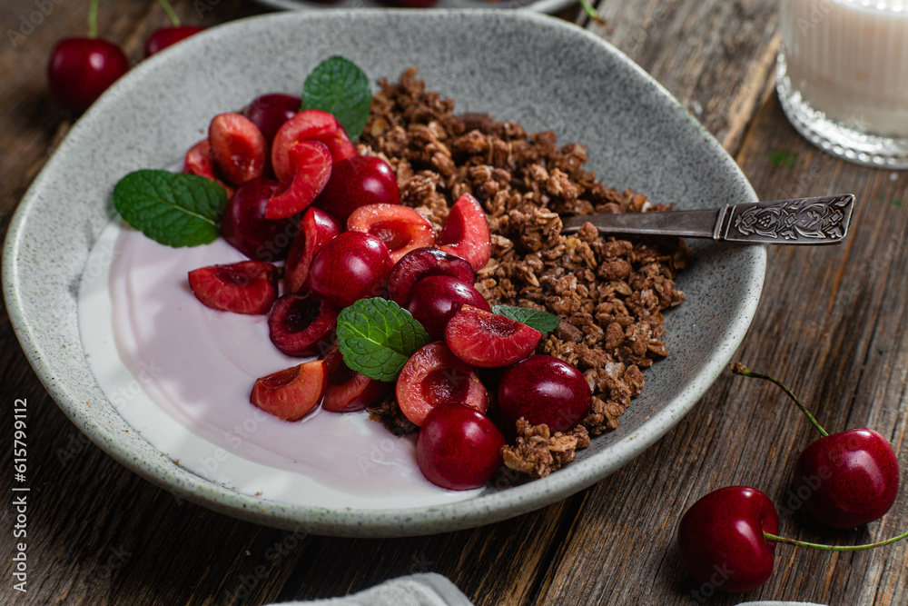 Granola with yogurt and cherries in a bowl
Granola with yogurt and cherries in a bowl