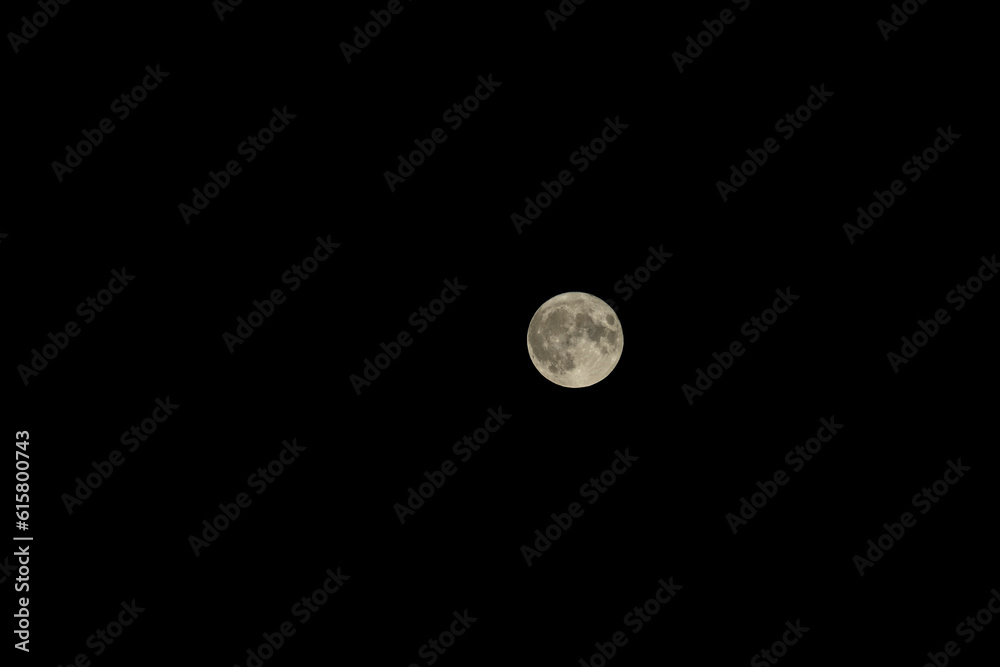 Night sky with full bright moon in the clouds Night sky with full bright moon in the clouds