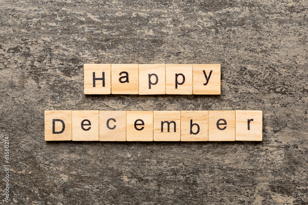 Fototapeta premium Happy december word written on wood block. Happy december text on table, concept