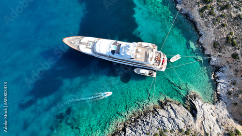Aerial drone photo of luxury yacht anchored in tropical exotic island with crystal clear turquoise sea © aerial-drone