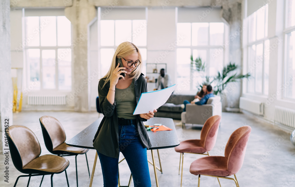 Businesswoman discussing project on smartphone Businesswoman discussing project on smartphone