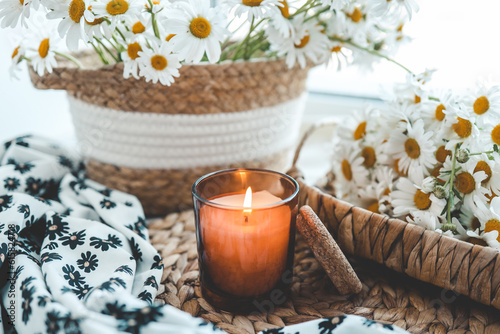 Candle and daisies  summer composition
