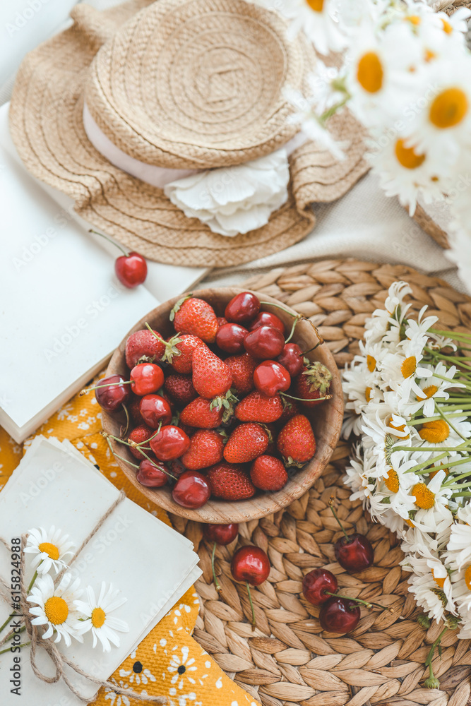 Summer composition, plate with strawberries and chamomile Summer composition, plate with strawberries and chamomile