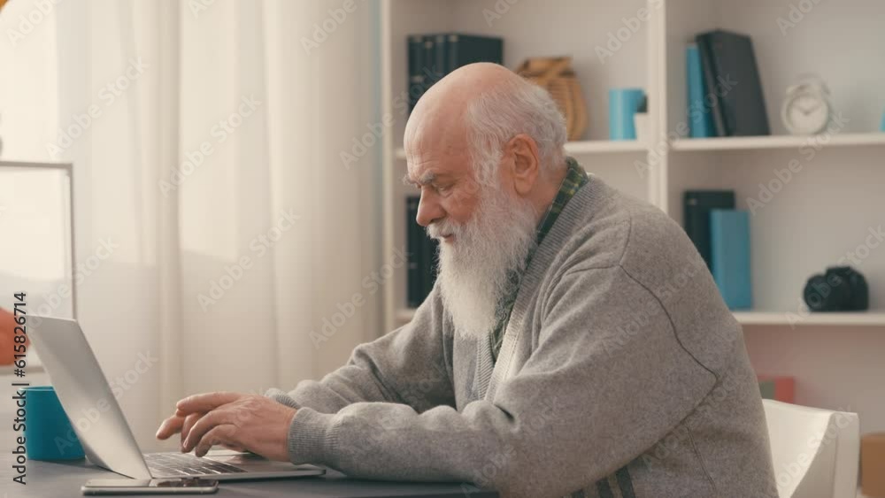 Contemporary grandpa typing on laptop at home, modern apps for seniors, media Contemporary grandpa typing on laptop at home, modern apps for seniors, media