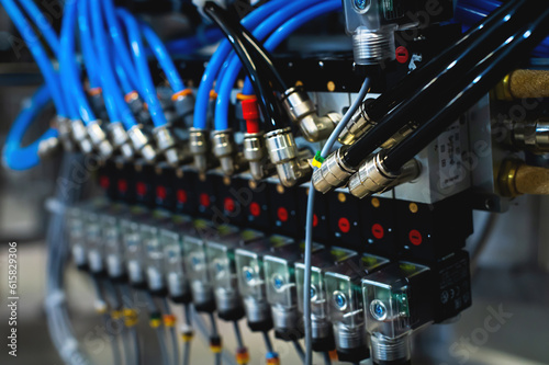 Pneumatic control board in production. Distributor of pneumatic control lines. Industrial photo