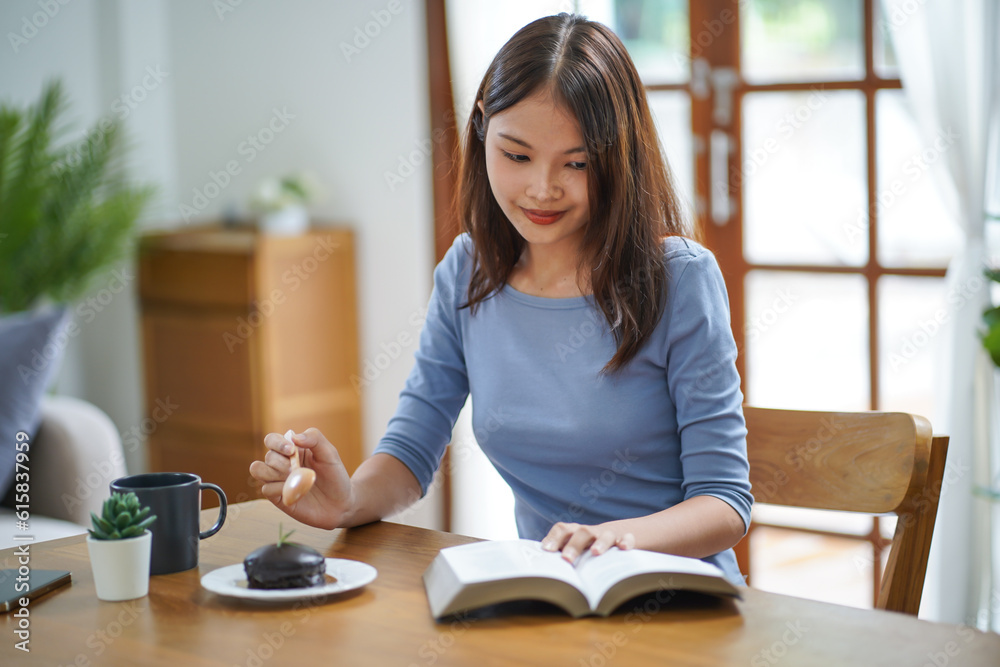 Happy woman reading a book and relaxing comfortably. Female hands with book at home Study Concept reading book