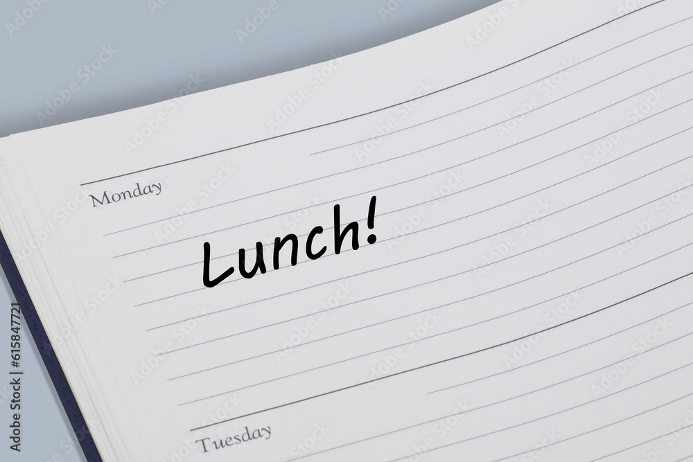 Lunch reminder note in black ink on a diary page Lunch reminder note in black ink on a diary page