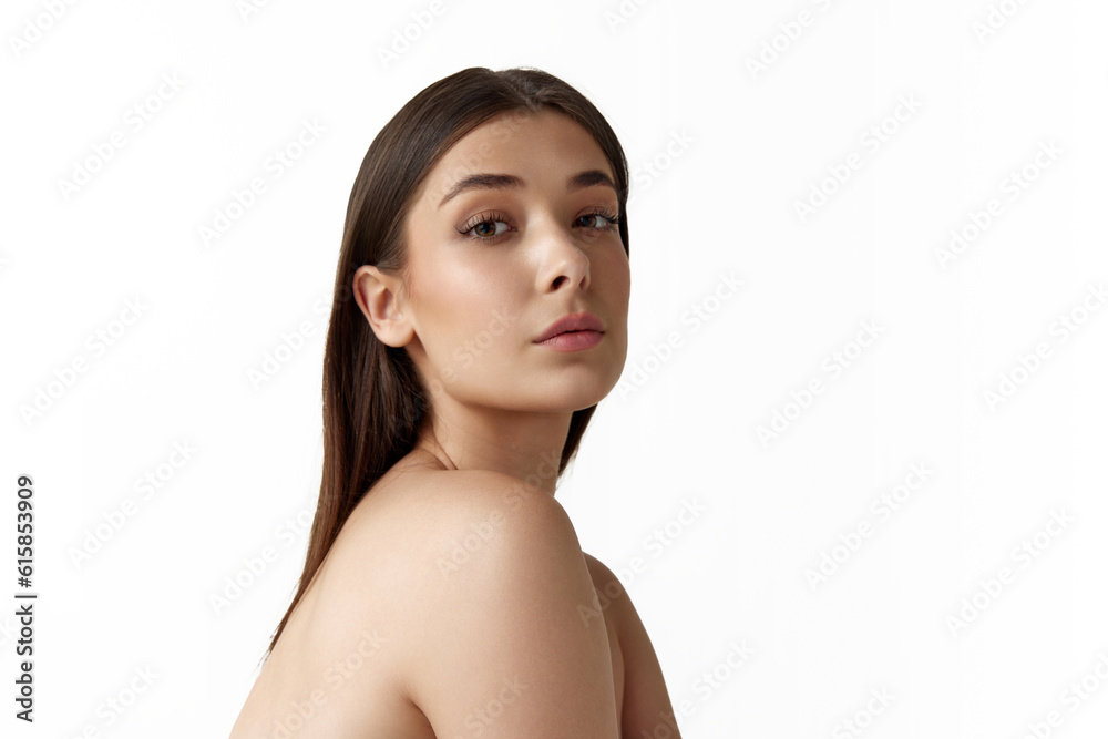 Portrait of beautiful young woman with straight hair and well-kept smooth skin posing against white studio background. Concept of natural female beauty, body and skincare, cosmetology, health, ad Portrait of beautiful young woman with straight hair and well-kept smooth skin posing against white studio background. Concept of natural female beauty, body and skincare, cosmetology, health, ad