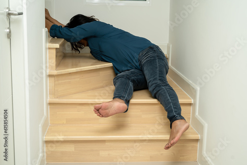 Asian lady fall down the stairs and pain at hip and waist because slippery surfaces.