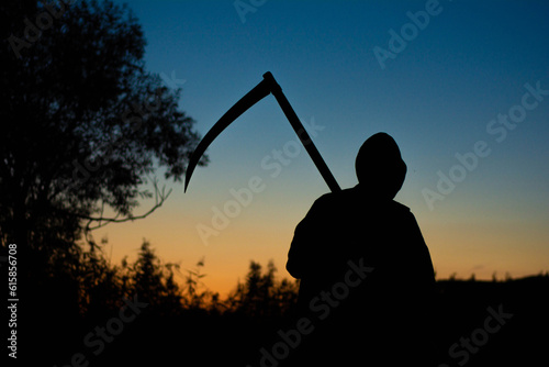 grim reaper the death itself scary horror shot of Grim Reaper holding scythe