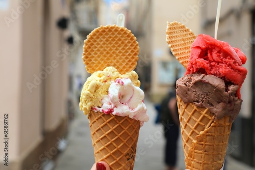 Ice cream in Alghero, Sardinia. Hand holding Italian gelato ice cream in cone. photo