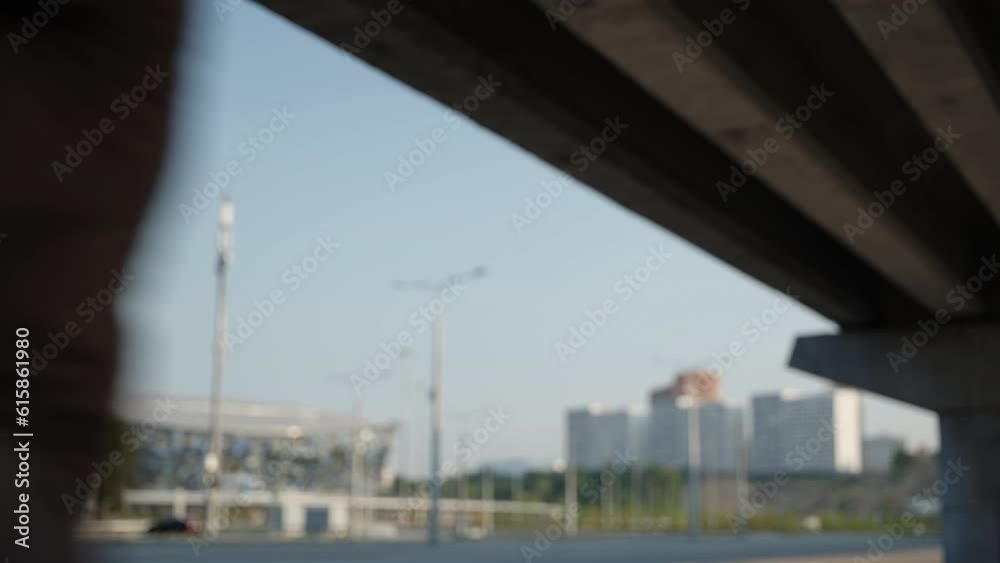 The motorcyclist starts the bike and drives off the frame. A man in black clothes and a biker helmet leaves on a motorcycle. The motorcyclist starts the bike and drives off the frame. A man in black clothes and a biker helmet leaves on a motorcycle.