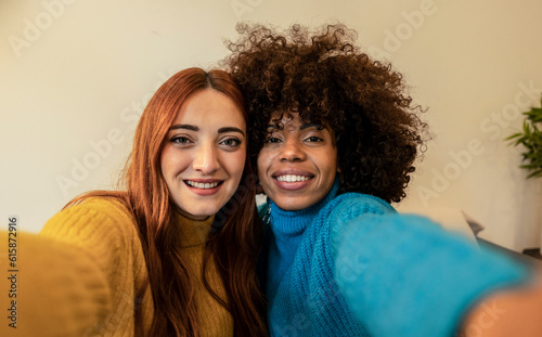 selfie two multiracial young female friends, social media